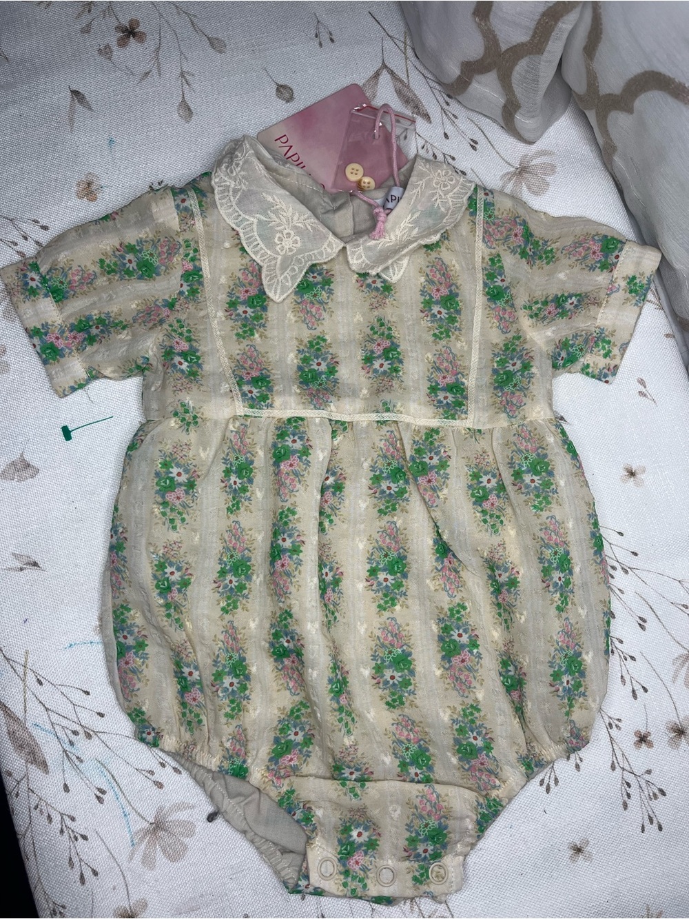 Papillon Blanc Cream Romper with Pink Trim and Green Floral Accents